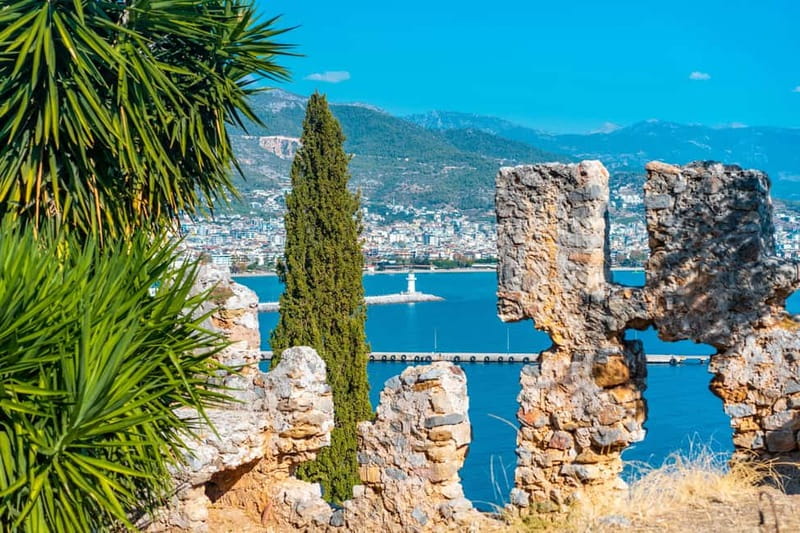 Alanya: Castle Sunset Tour, Damlatas Cave&Cable Car Options - Hotel pickup in an open midibus