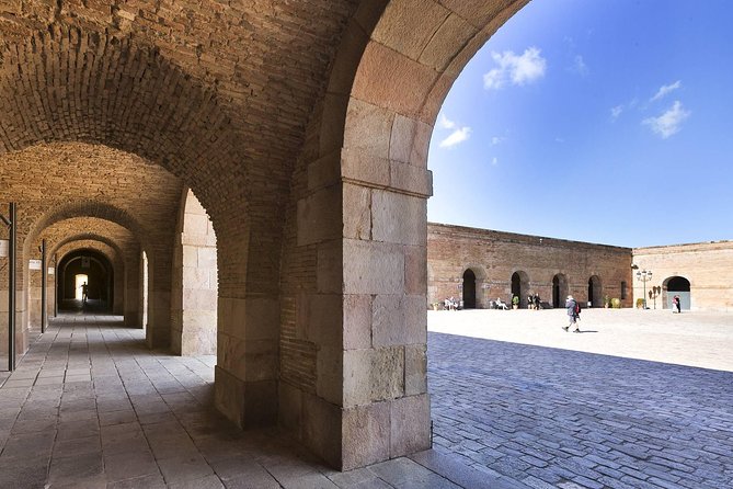 Barcelona Best Views: Old Town, Cable Car and Montjuic Castle - Tapas with a local drink breaks up the walking