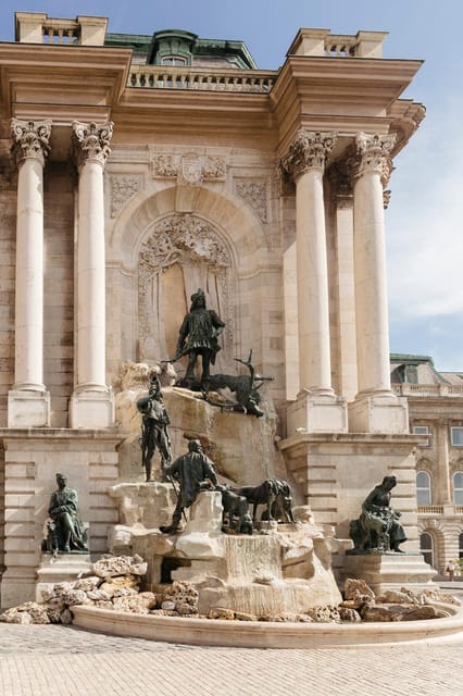 Budapest: Buda Castle Walking Tour & Folk Music Performance - Matthias Church and the story of King Matthias
