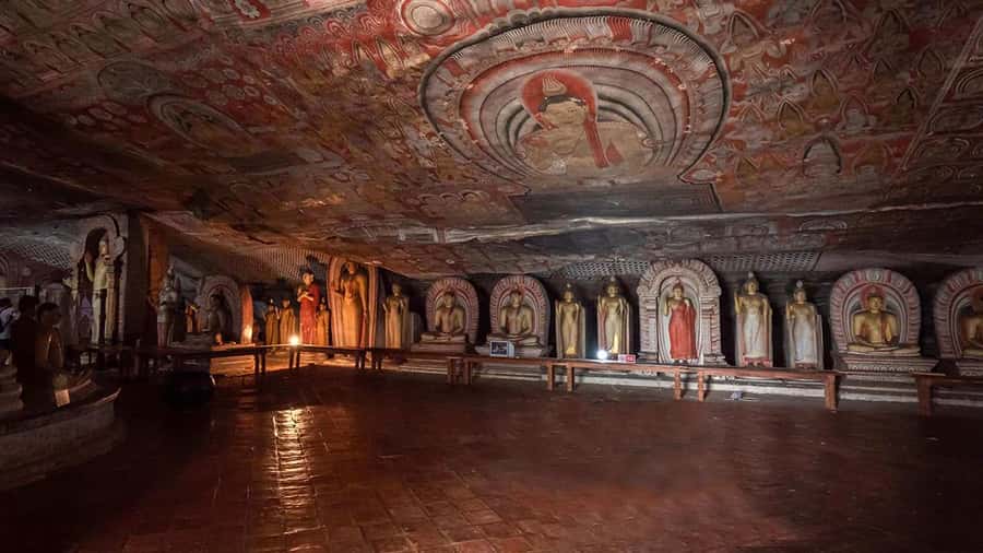 Colombo: Sigiriya Rock Fortress & Dambulla Cave Temple Tour - Entering the five caves at Dambulla