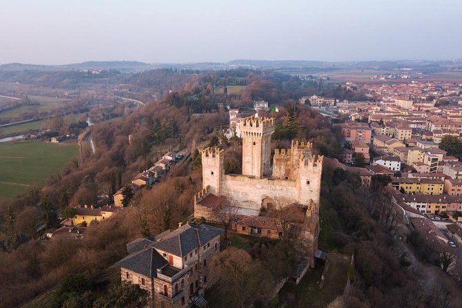 E-bike adventure among medieval castles and old villages - Riding through vineyards and fruit trees