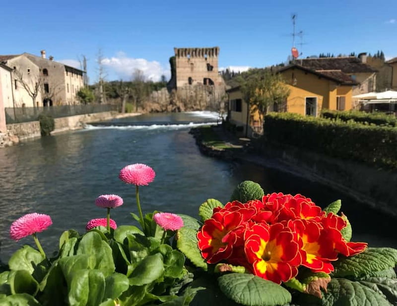 E-bike adventure among villages and medieval castles - Following the Tione through fruit trees and vineyards