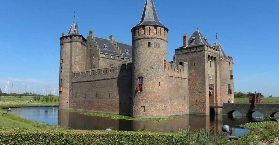 From Amsterdam: Private Day Trip to the Dutch Castles - Entering Muiden Castle by drawbridge