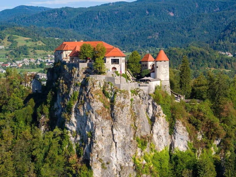 From Ljubljana: Lake Bled, Postojna Cave and Predjama Castle - Lake Bled begins with a cliff-top view