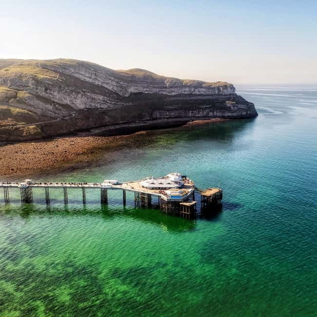 From Llandudno: Portmeirion, Snowdonia and Castles Tour - The Great Orme Road opens the day