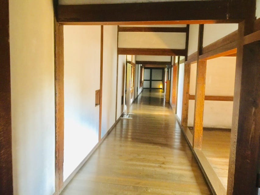 Himeji: Private Guide Tour of the Castle from Osaka or Kyoto - Inside Himeji Castle: white walls, steep paths, and military design