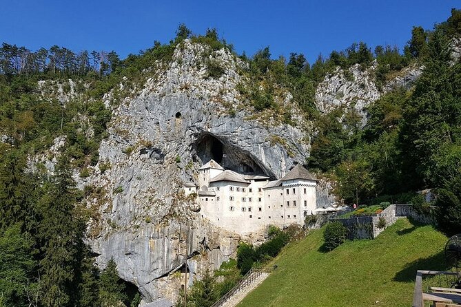 Ljubljana: Postojna cave & Predjama castle small group tour - Predjama Castle Against the Cliff