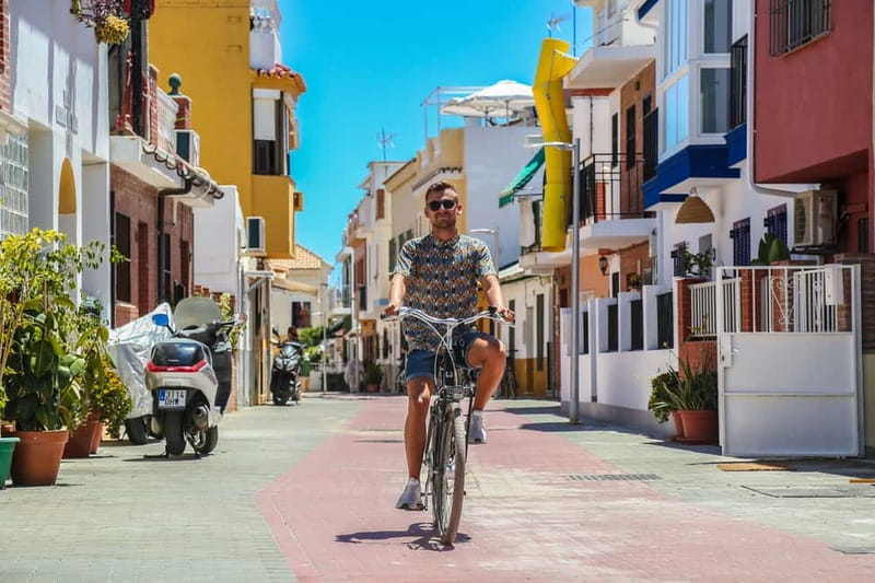 Malaga: Castle Hill and Fisherman Village E-Bike Tour - Starting through Málaga’s historic center