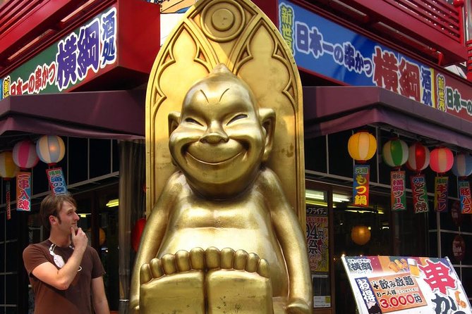 Osaka Highlights: 4-Hour Walking Tour with Castle - Osaka Castle: grand grounds, limited interior
