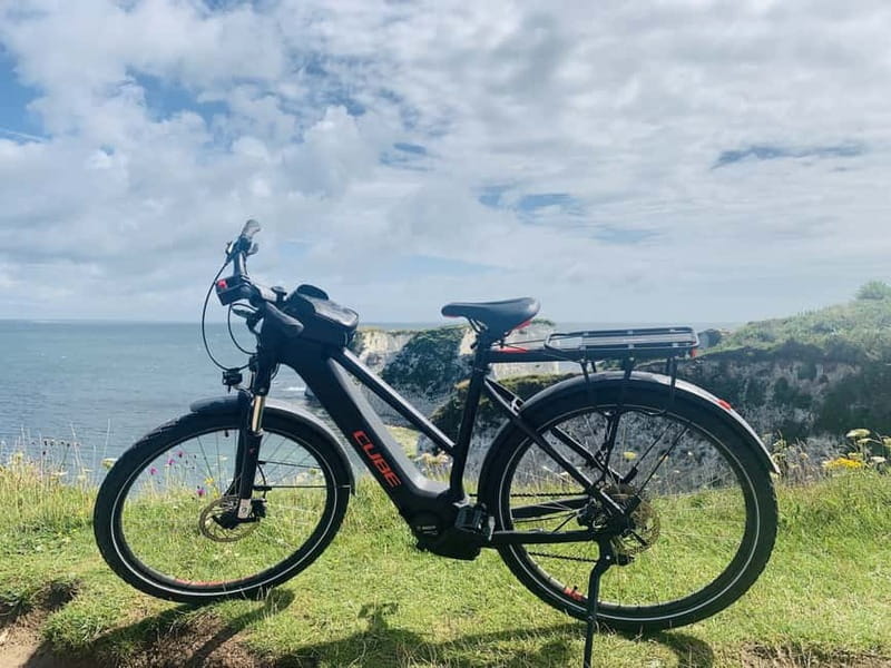 Poole: Old Harry Rocks and Corfé Castle Guided E-bike Tour - The guide service and small touches