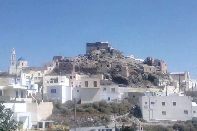 Santorini Highlights and Venetian Castles Small-Group Day Tour - Wine in an old canava at Artemis Karamolegos