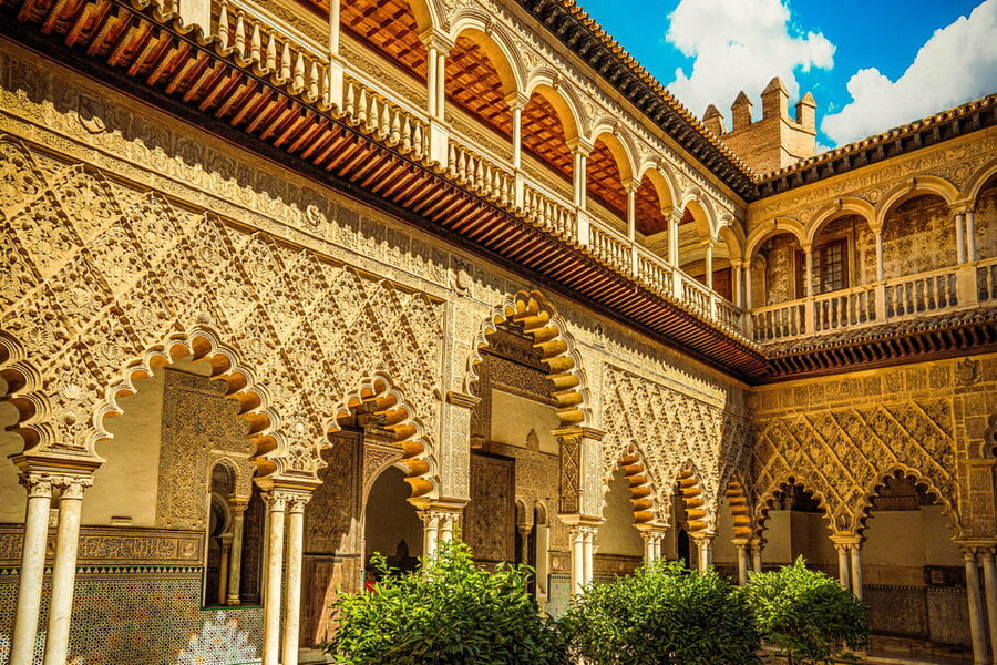 Seville: Priority Access Cathedral, Giralda & Alcázar Tour - Patio de Doncellas and the palace details worth slowing down for